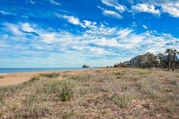 Panoramic Castle of Peñíscola with blue sky with broken clouds in spring on the seashore