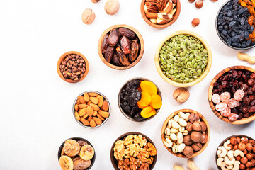 Nuts and dried fruits. Dried apricots, figs, raisins, pecans, walnuts, hazelnuts, almonds and other. White background, top view