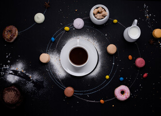 cup of coffee, donuts, macaroons, sugar, milk cream jug and cakes on the black background look like...