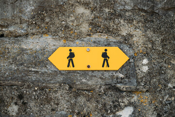 Yellow hiking route sign