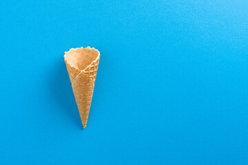 Ice Cream Empty Waffle Cone on solid blue background