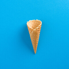 Ice Cream Empty Waffle Cone on solid blue background