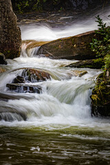 Small cascades flow at the bottom of Glen Cannon falls in North Carolina