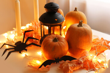 halloween pumpkin lantern, candles autumn leaves, halloween holiday, pumpkin table decoration.