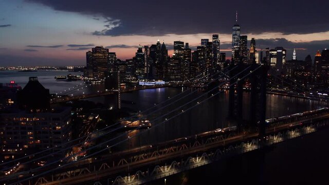 evening flying over the Manhattan Bridge towards downtown NYC