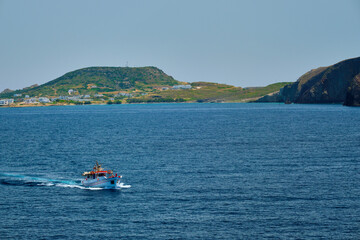 Greek fishing boat in Aegean sea near Milos island, Greece
