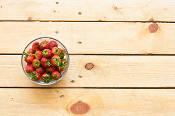 Strawberry in glass bowl on wooden background
- 434369334
