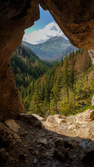 The entrance to the Mylna Cave in Polish Tatra Mountains. There are many mountain ranges in the...