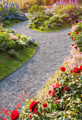 Fototapeta na wymiar path leading through a flower garden
