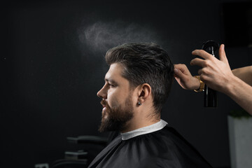 Barber making hairstyle for confident bearded hipster. Advertising for barbershop and men's beauty...