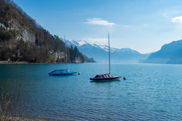 Two boats lying at the shore of lake, Brienzersee, Switzerland