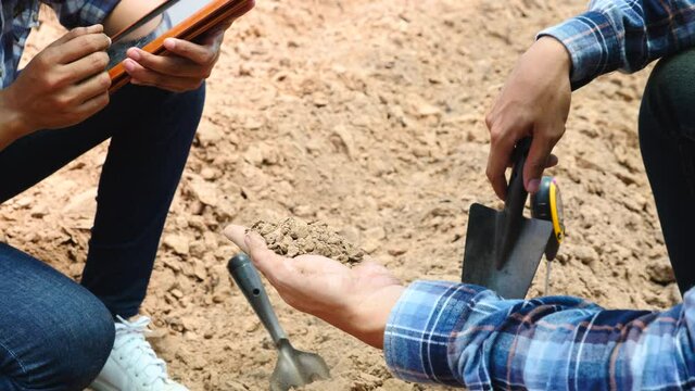 The new generation of farmers are examining the physical properties of the soil and taking notes with their tablets.