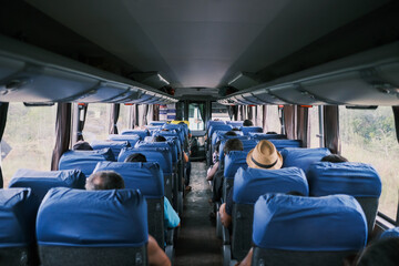 Interior of bus with passengers seated in their seats