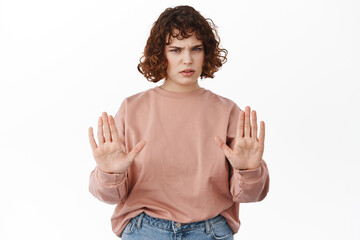 Stop, back off. Serious curly girl, showing block prohibit gesture, rejecting something, stay away...