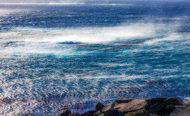 Obraz premium stormy sea with heavy wind gusts an flying water spray 