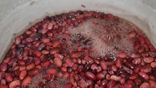 Red beans are cooked in a saucepan. Beans close-up.