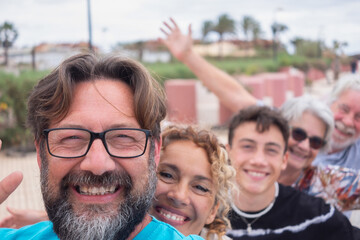Joyful multi generation family having fun together, parents, teenage son and grandparents. Smiling...