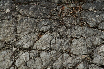 horizontally oriented background image, cracked flat section of stone rock 