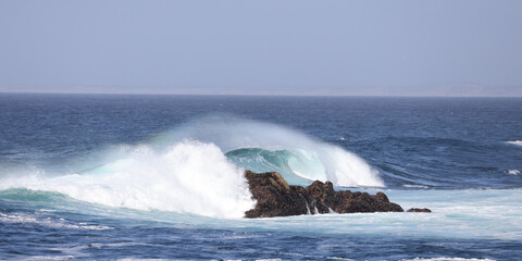 waves breaking on the rocks