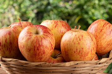 Fototapeta na wymiar Apples fruits in basket with blurred background