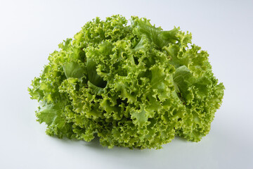 Raw green lettuce isolated on white background