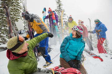 Group of backcountry skiers throwing snow