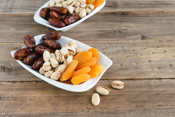 Variety of nuts on wood background. Copy space.