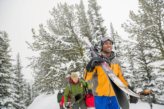 Group Of Male Backcountry Skiers Hiking In The Mountains