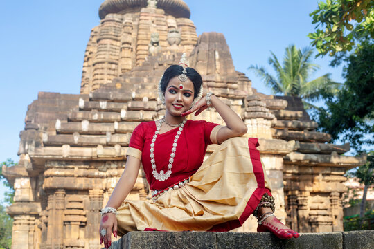Beautiful indian girl dancer in the posture of Indian odissi dance at Parsurameswara Temple Bhubaneswar, Odisha, India.Indian dance