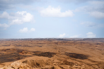Ramon Crater Makhtesh Ramon, the largest in the world, as seen from the high rocky cliff edge surrounding it from the north, Ramon Nature reserve, Mitzpe Ramon, Negev desert, Israel. High quality