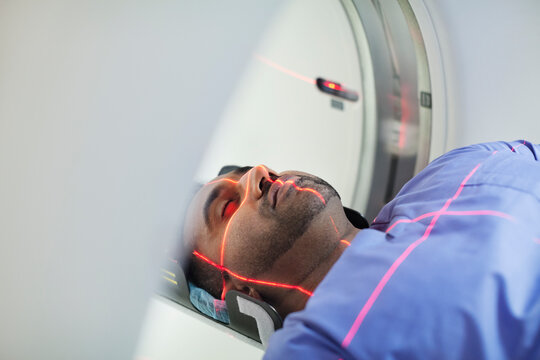 Mid Adult Male Patient Undergoing CAT Scan