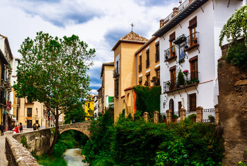 Fototapeta na wymiar Medieval buildings on Carrera del Darro. Granada, Andalusia, Spain.