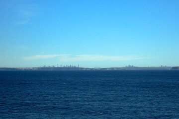 Fototapeta premium Sydney skyline in the distance from out at sea
