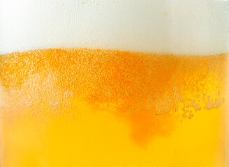 Beer and foam close-up background. Beer texture - 434387570