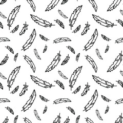 Vector seamless pattern with black feathers on a white background. Perfect for printing on fabric, paper.