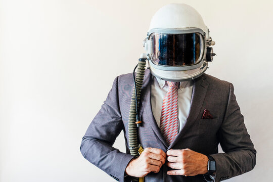 Businessman With Astronaut Helmet Looking To The Side