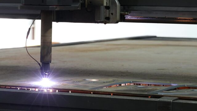 the plasma cutter at the machine-building enterprise cuts the metal billet of the billet