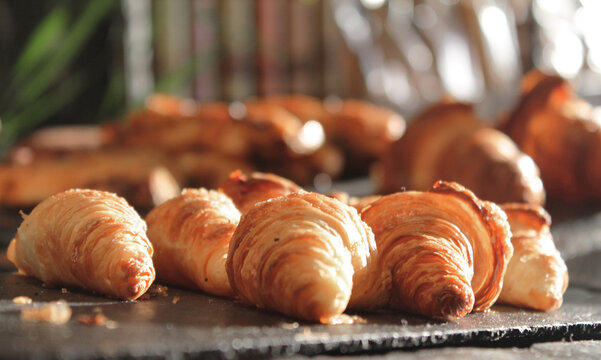 trays of mini croissants propped up in a display case