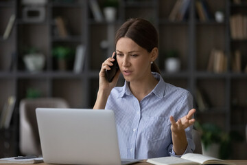 Bad things happen. Worried young lady manager calling client by cell to discuss breach of contract....