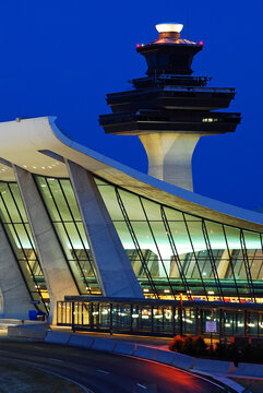 Washington DC Dulles Airport, with Terminal Building designed by Eero Saarinen, is illuminated at dusk
