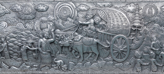 Detail of aluminium and silver bas-relief with stories of Buddhism, dharma puzzles, and the history of the Wat Sri Suphan, or silver temple in Chiang Mai, Thailand