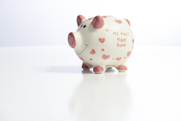 Piggy bank on table. Financial saving and save money concept and copy space