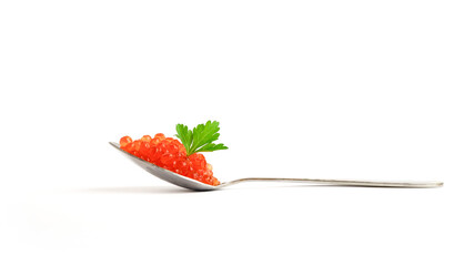 Spoon with red caviar and green parsley leaf on top isolated on white background.