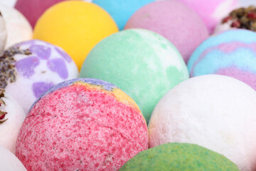 Colorful bath bombs as background, closeup view