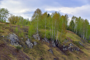 Mountain slopes near the Iren river in bad spring weather.