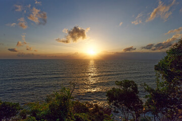 Fototapeta na wymiar Sunrise over beach horizon 
