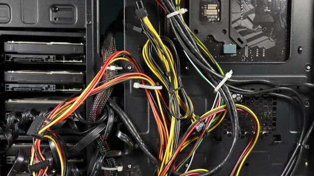 Closeup view 4k stock video footage of dusty personal computer network cables connected 