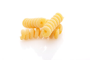 Uncooked fusilli corti bucati pasta isolated on white background. Close-up. Full depth of field.