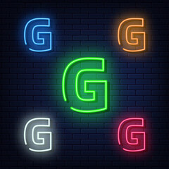 Neon letters, five colors: red, blue, green, yellow, white. Isolated font on a blue brick wall background. Vector illustration eps 10.