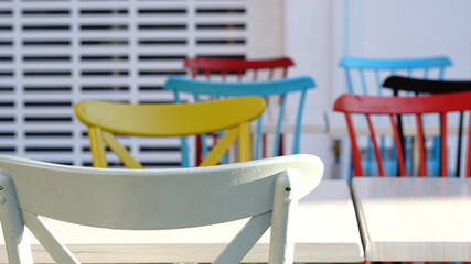 wooden chairs of different colors